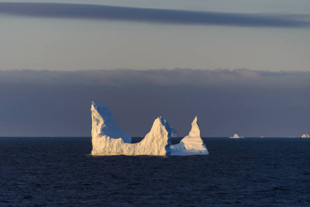 istock Antarctic seascape with iceberg 1057668198
