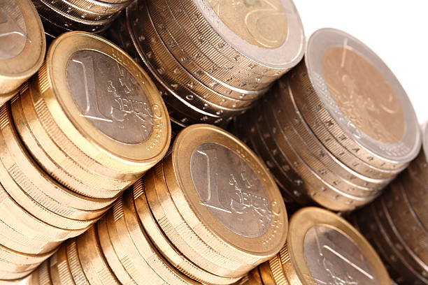 istock Coins organized in columns and rows isolated on white background 105766828