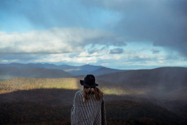 istock Young woman hiking through beautiful mountains. 1057668526