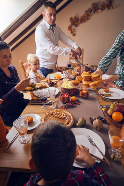 istock Family Having Traditional Holiday Stuffed Turkey Dinner 1057668782