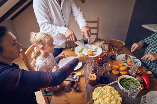 istock Family Having Traditional Holiday Stuffed Turkey Dinner 1057668802