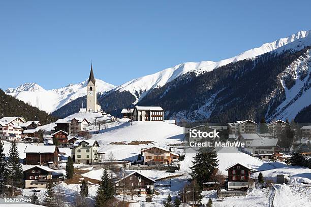 Mountain Village In Winter Alps Near Davos Stock Photo - Download Image Now - Davos, Switzerland, Winter