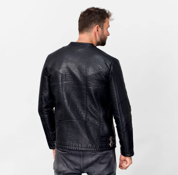 istock Tall man back portrait in black jacket, isolated on white 1057675974