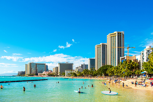 Honolulu beach with kayaks and leisure equipment,  Oahu, Hawaii, USA