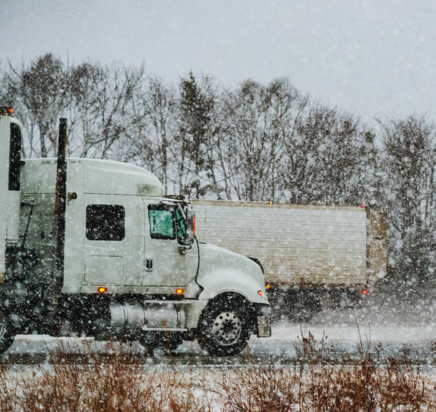 istock Trucking in Winter Storm 1057682440