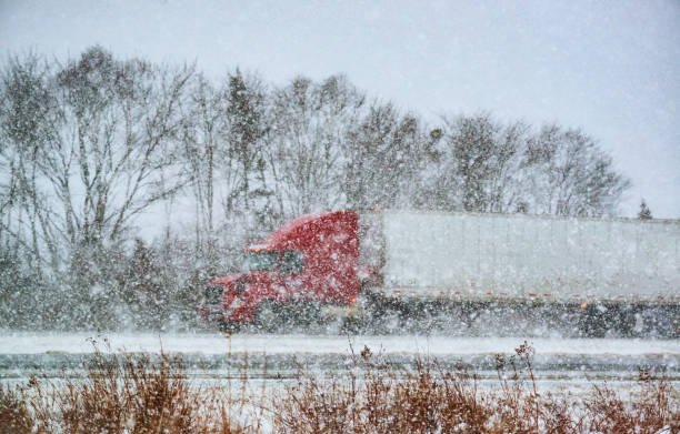 istock Trucking in Winter Storm 1057682452