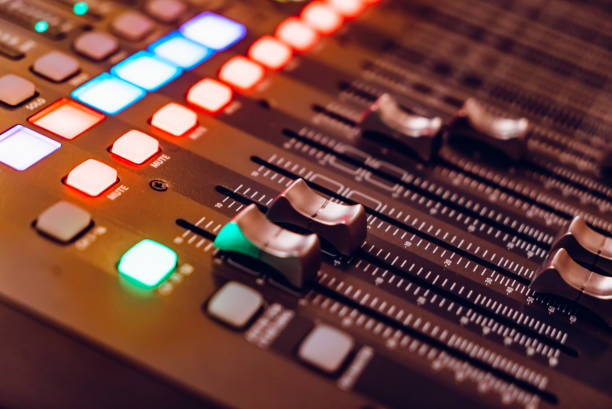 istock mixing console for recording with faders and bright buttons is in the building. 1057687872