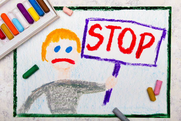 Colorful drawing: Sad boy holding a STOP sign in his hand