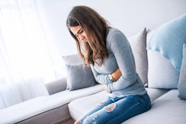 istock Woman stomach pain 1057699604