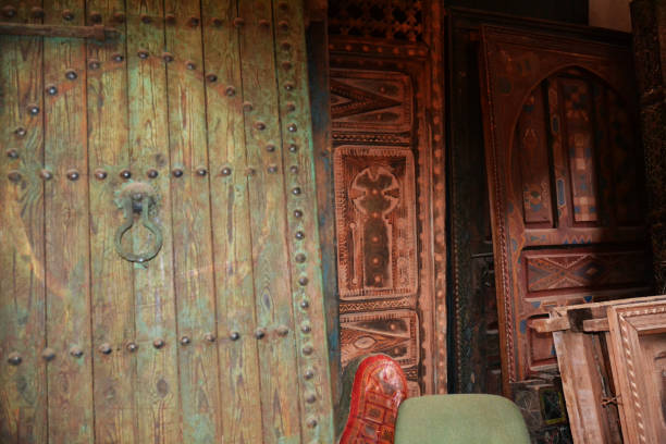 close up detail of traditional door furniture on a wooden door in the souk market in the medina Marrakesh, Morocco