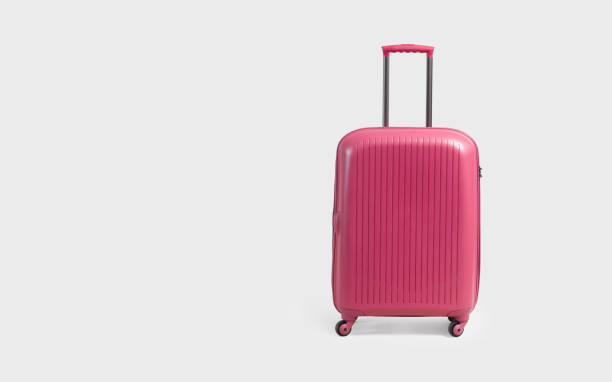 istock Pink trolley suitcase isolated on white 1057702212