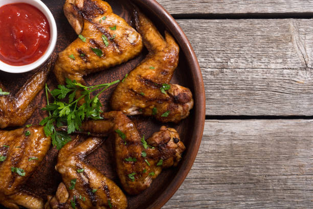 istock Grilled chicken wings with tomato sauce 1057714214
