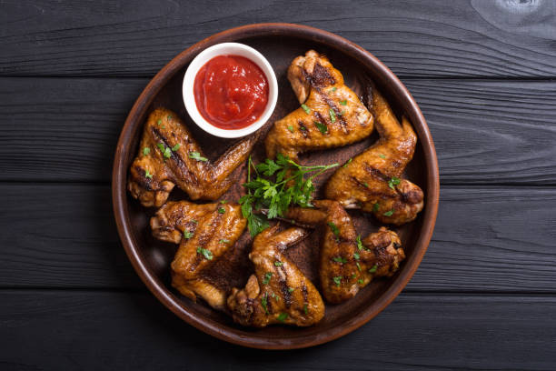 istock Grilled chicken wings with tomato sauce 1057714228