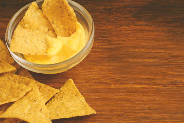 istock Top view of nachos with cheese dip 1057714424