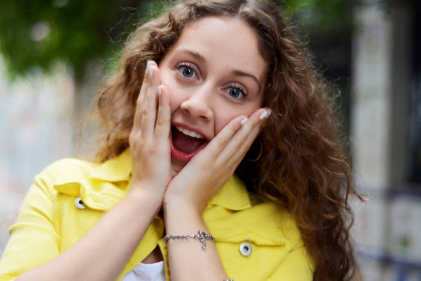 istock Young latin woman with surprised facial expression. 1057714468