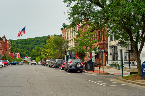 Cooperstown, NY, USA - September 8, 2018: The picturesque Main Street of this baseball town is lined with attractive shops, cafes, and businesses.