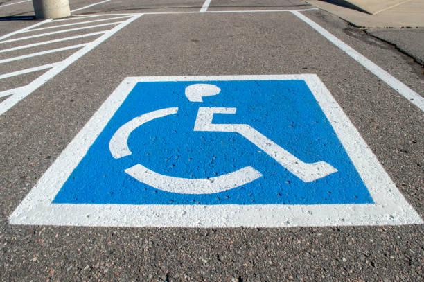 istock Empty parking spot with handicapped parking symbol 1057722808
