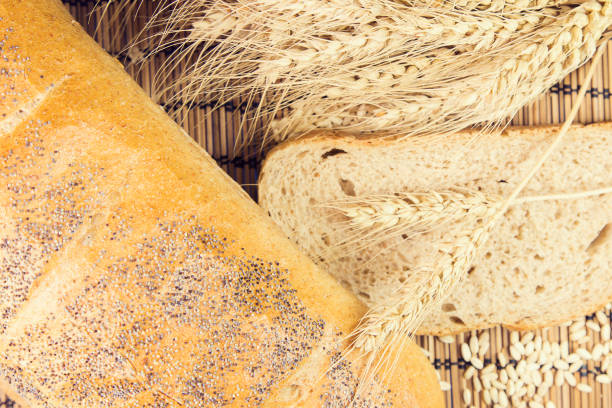 fresh bread and wheat on the wooden