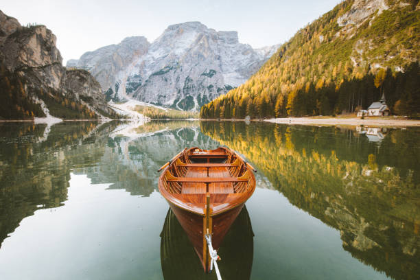 istock Traditional rowing boat on a lake in the Alps in fall 1057725788