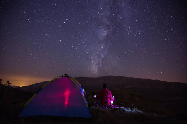 istock Camping In Outdoor Under Sky With Milky Way 1057732168