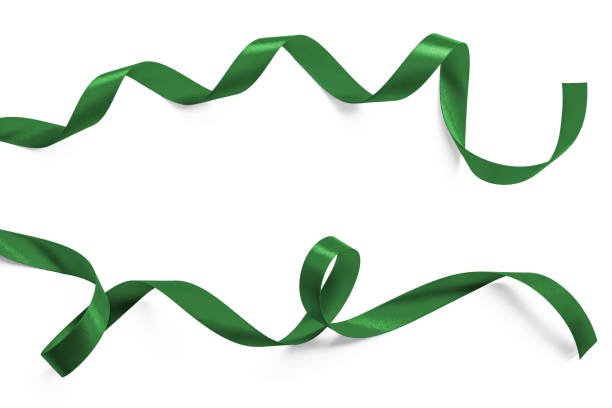 green ribbon satin curly bow in jade emerald color (isolated with clipping path) on white background for christmas holiday decoration element - ribbon curled up hanging christmas imagens e fotografias de stock