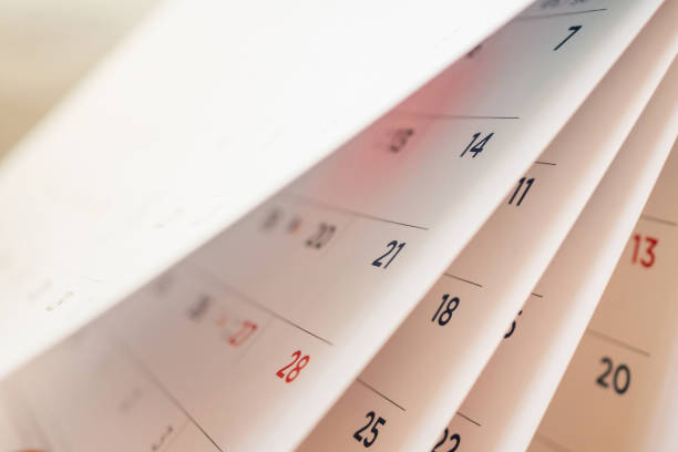 istock Abstract blur calendar page flipping sheet close up background 1057734416