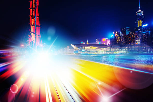 istock City night view with moving traffic light trails. double exposure 1057735184