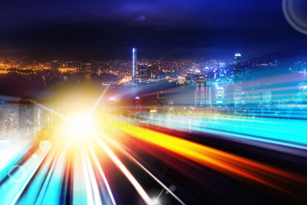 istock City night view with moving traffic light trails. double exposure 1057735190