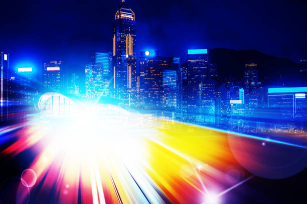 istock City night view with moving traffic light trails. double exposure 1057735226