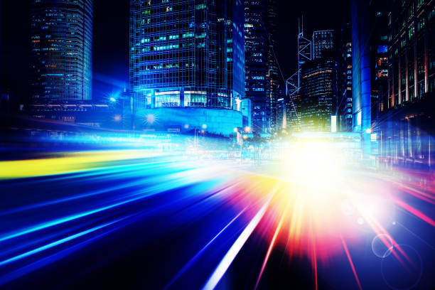 istock City night view with moving traffic light trails. double exposure 1057735240