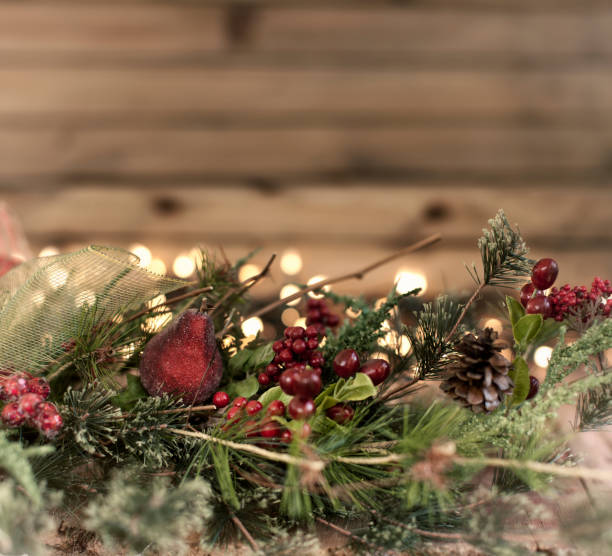istock Christmas Wreath against an Old Wood Background 1057740086