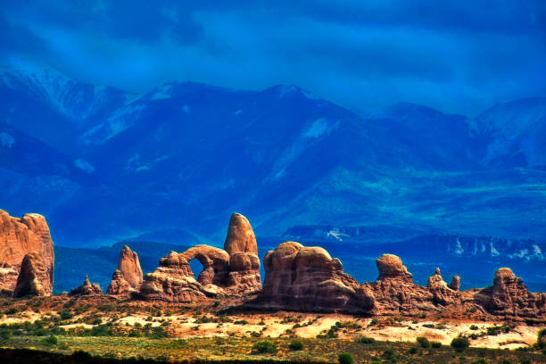 istock Turret Arch and Mountains in Background 1057743076