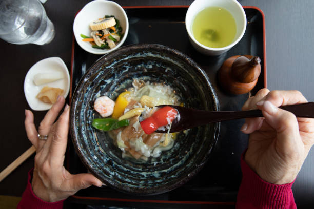 istock Senior woman enjoying having lunch 1057749608