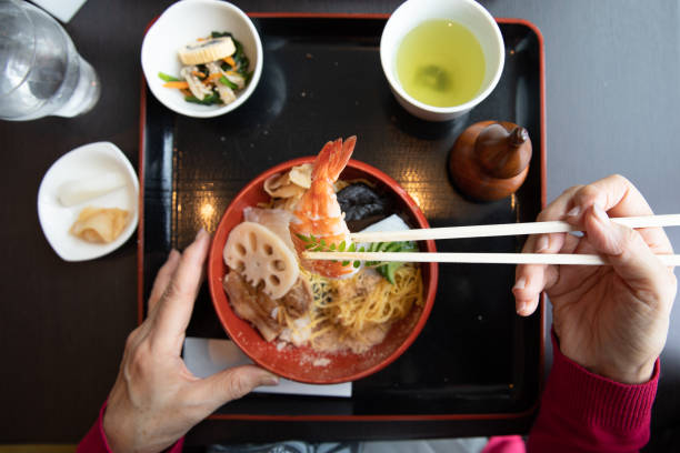istock Senior woman enjoying having lunch 1057749616