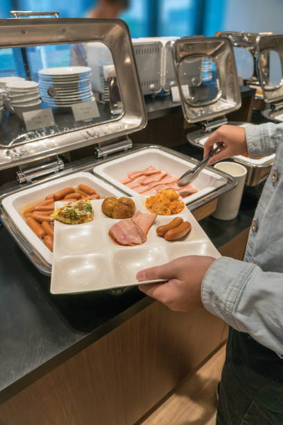 istock People select food in the buffet breakfast 1057751842
