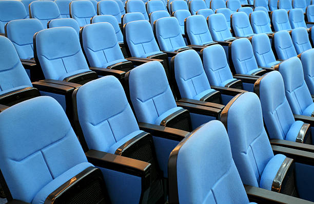 istock blue chair seats in an empty conference room 105775273