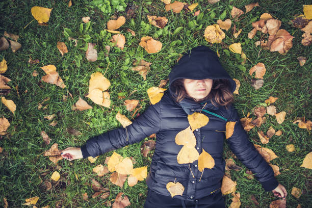 istock Laying  on Autumn Leaves 1057753508