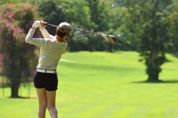 istock Woman playing golf on a beautifully natural golf course 1057754950