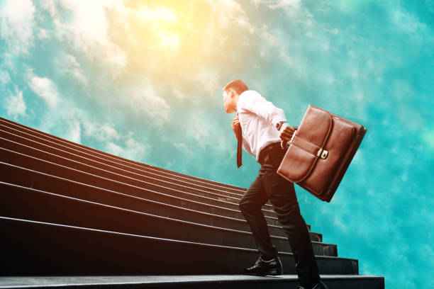 istock Businessman standing on stair and moving to sky future. 1057756794