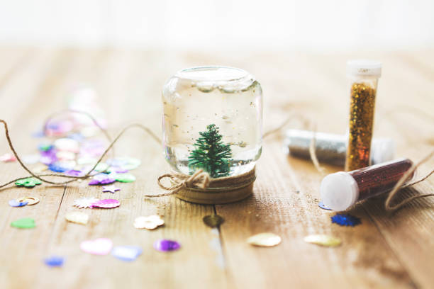 Homemade snow globe Homemade snow globe, christmas tree in a jar snow globe photos stock pictures, royalty-free photos & images