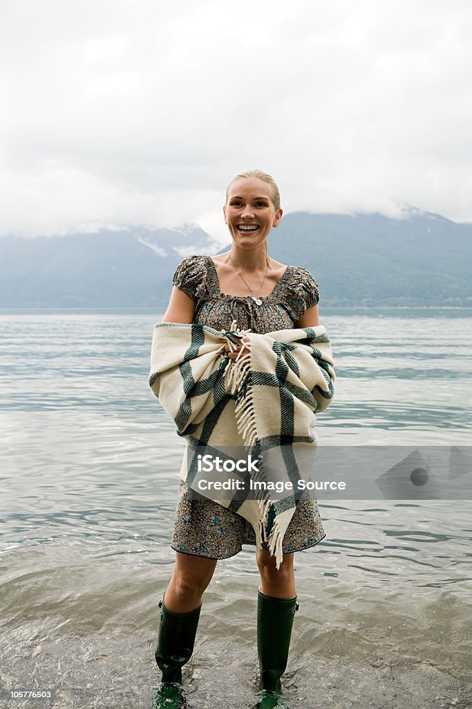 Mid adult woman standing in lake  30-34 Years Stock Photo