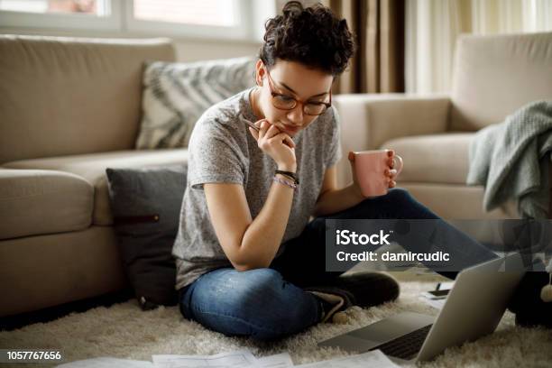 Young Woman Working At Home Stock Photo - Download Image Now - Domestic Life, Contemplation, Learning