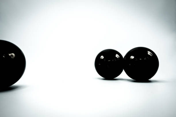istock Black Christmas baubles on white background. 1057768304