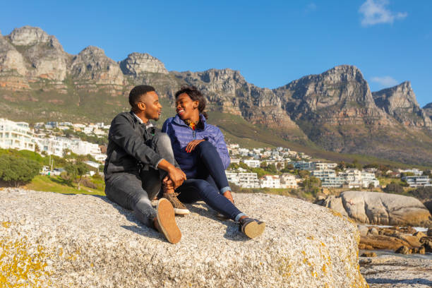 istock Romantic Young African Couple Hugging on the Beach 1057770666