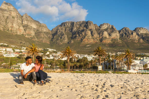 istock Romantic Young African Couple Hugging on the Beach 1057770668