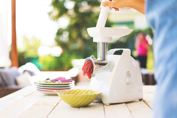 meal preparation with a meat grinder - meat grinder ground beef meat imagens e fotografias de stock