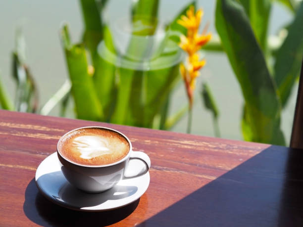 istock cup of coffee on wooden table 1057776452