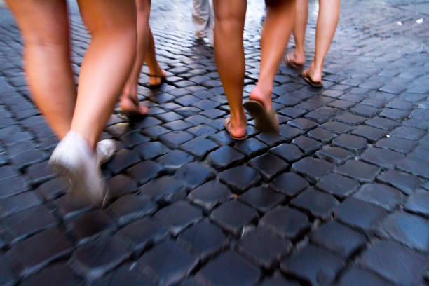 Visitors walk the ancient streets. Rome, Italy