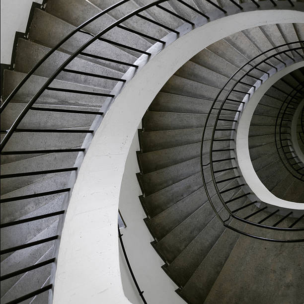 istock Gray and white spiral staircase as seen from the top 105778175