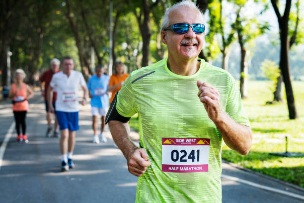 istock Mature runners running in a race 1057784388